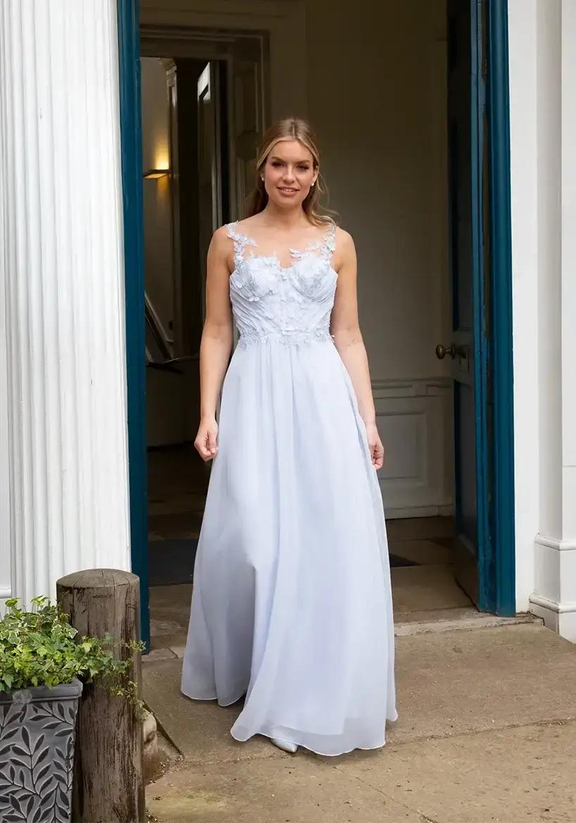 Model wearing Emma Bridals gown.